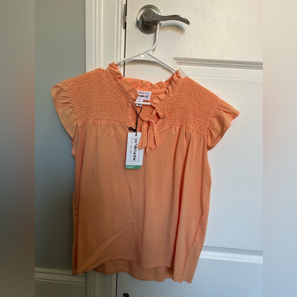 Soft Peach Ruffled Cap Sleeve Top from For The Republic